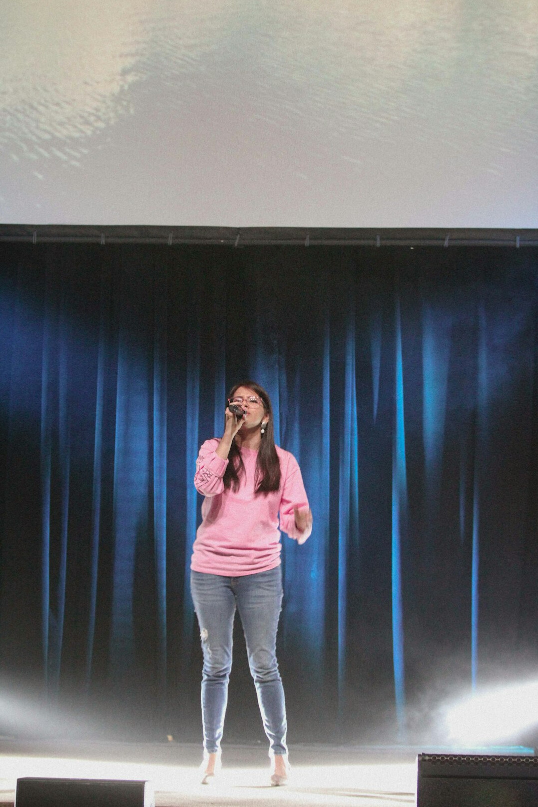 confident speaker on stage